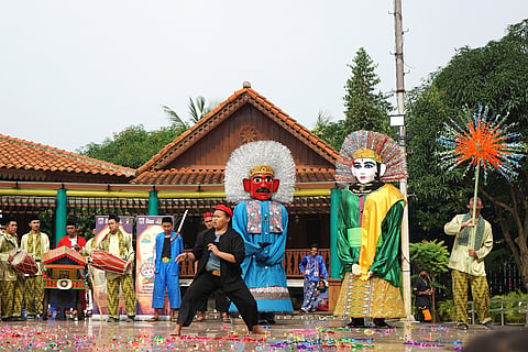 A Betawi folk performance called Ondel-Ondel at Setu Babakan Betawi Traditional Village